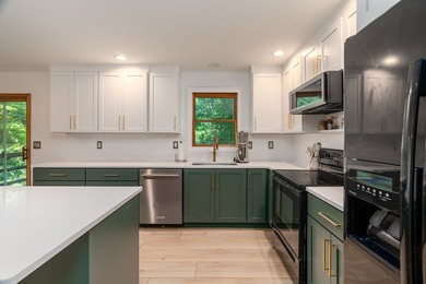 Tucked away on a peaceful one-acre wooded lot, this 4-bedroom, 3 - photo 8