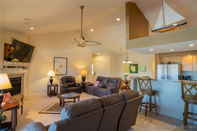 Elevate your Lake lifestyle in this premier Top Floor residence