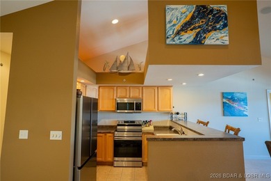 Elevate your Lake lifestyle in this premier Top Floor residence