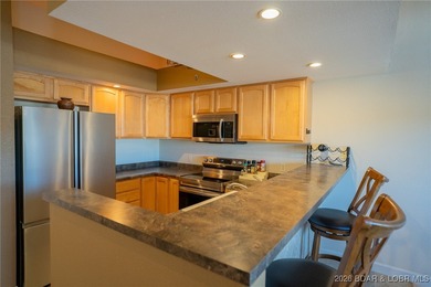 Elevate your Lake lifestyle in this premier Top Floor residence