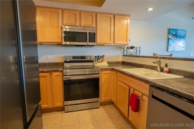 Elevate your Lake lifestyle in this premier Top Floor residence