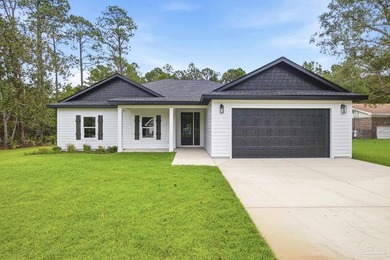 Just minutes from the sound, this brand-new 3-bedroom, 2-bath - photo 1