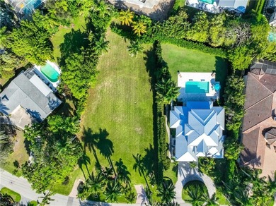 THIS TURNKEY FURNISHED HOME BOAST A .56 ACRE LOT. This Manicured - photo 3