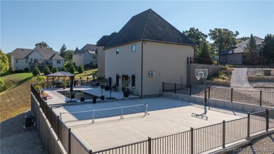 Welcome to a one-of-a-kind luxury estate in a gated Osage Beach