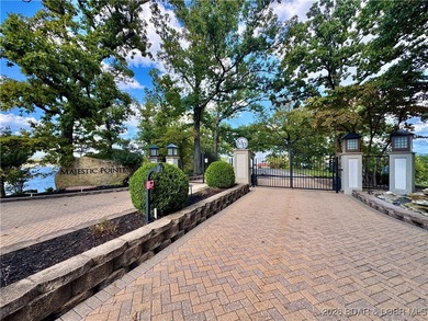 Welcome to Majestic Pointe Unit 1A, a rare end-unit in a gated