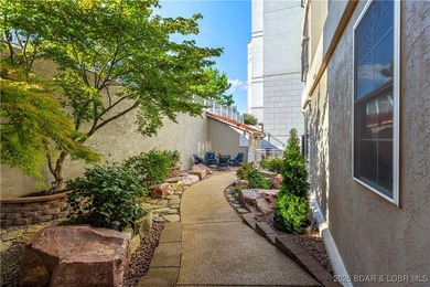 Welcome to Majestic Pointe Unit 1A, a rare end-unit in a gated