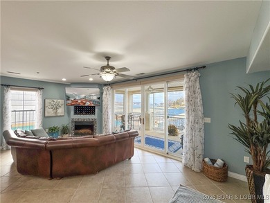 Welcome to Majestic Pointe Unit 1A, a rare end-unit in a gated