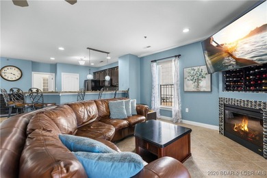 Welcome to Majestic Pointe Unit 1A, a rare end-unit in a gated