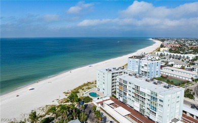 Experience true beachfront living in this stunning corner-unit - photo 13