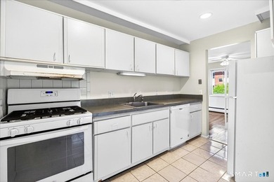 Move-In Ready End Unit! Welcome home to this bright and inviting - photo 2