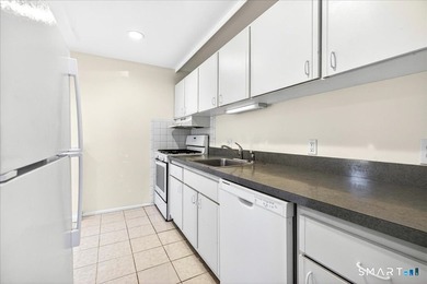 Move-In Ready End Unit! Welcome home to this bright and inviting - photo 3
