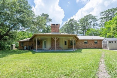 Lake Home For Sale in Carriere, Mississippi