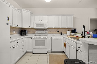 Enjoy peaceful lake living in this beautifully situated