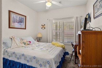 Enjoy peaceful lake living in this beautifully situated