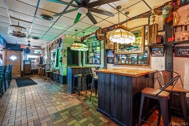 Welcome to The Dart Inn, a beloved neighborhood sports bar in - photo 12
