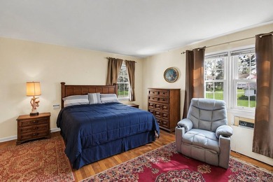 This Munsey Park brick split-level home is situated on a - photo 12