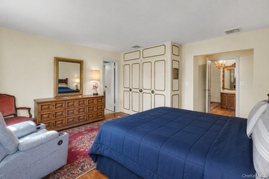 This Munsey Park brick split-level home is situated on a - photo 13