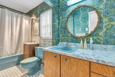 This Munsey Park brick split-level home is situated on a - photo 14
