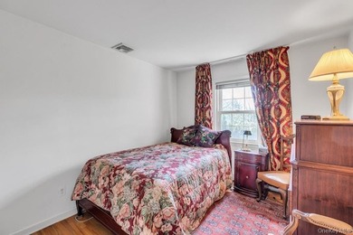 This Munsey Park brick split-level home is situated on a - photo 15