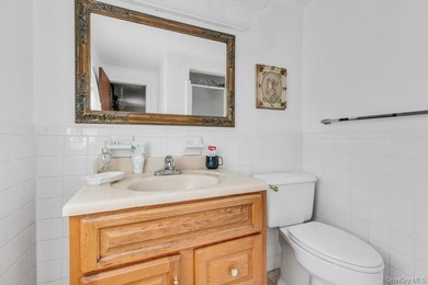 This Munsey Park brick split-level home is situated on a - photo 17