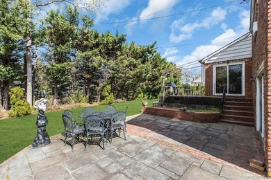 This Munsey Park brick split-level home is situated on a - photo 24