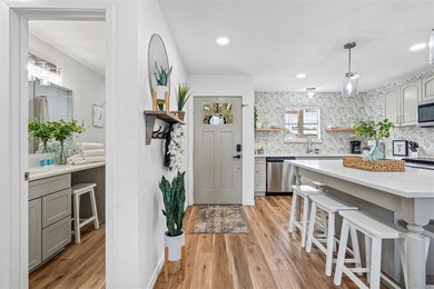 Step into lake life with this stylishly updated getaway on the - photo 2