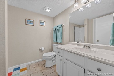 Top-floor condo living in the heart of Osage Beach! Located in - photo 14