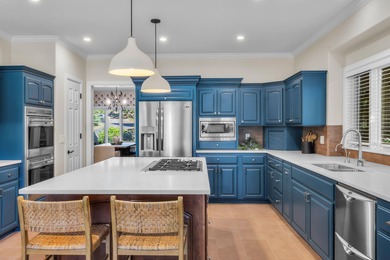 Picturesque lake and 17th-fairway views from this beautifully - photo 18