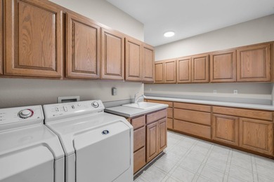 Picturesque lake and 17th-fairway views from this beautifully - photo 49