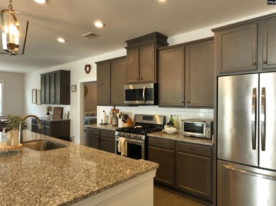 Welcome home to this beautiful all-brick ranch located in the - photo 18