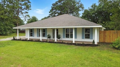 Lake Home For Sale in Carriere, Mississippi