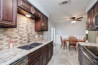Welcome to this well-maintained one-story brick home located on - photo 16
