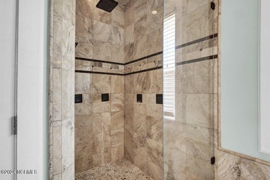 Located on the south end of Figure Eight Island, this stunning