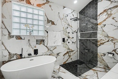 Welcome to refined, single-level luxury in the highly desirable - photo 16