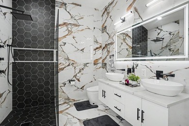Welcome to refined, single-level luxury in the highly desirable - photo 17