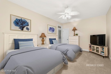 This stunning home is located in the highly desirable gated