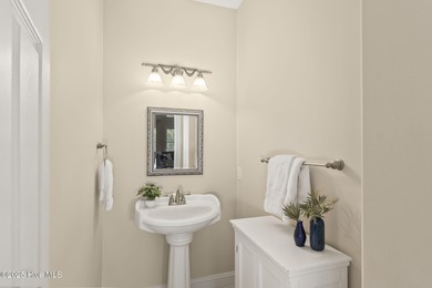 This stunning home is located in the highly desirable gated