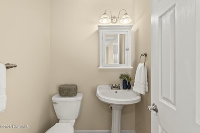 This stunning home is located in the highly desirable gated