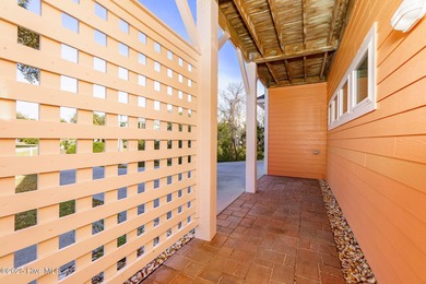 This stunning home is located in the highly desirable gated