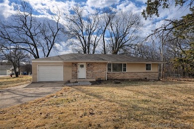 Charming, comfortable, and completely updated, this home in the - Lake Home For Sale in Camdenton, Missouri