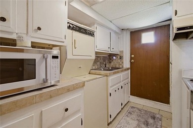 Tucked away on a quiet street and backing directly onto the open - photo 30