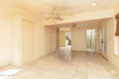 This charming brick ranch stands out on its corner lot within