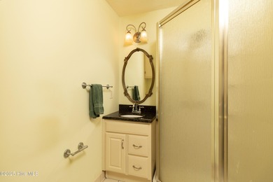 This charming brick ranch stands out on its corner lot within