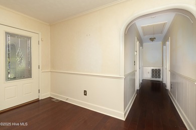 This charming brick ranch stands out on its corner lot within