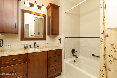 This charming brick ranch stands out on its corner lot within