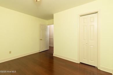 This charming brick ranch stands out on its corner lot within