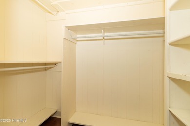 This charming brick ranch stands out on its corner lot within