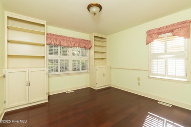 This charming brick ranch stands out on its corner lot within