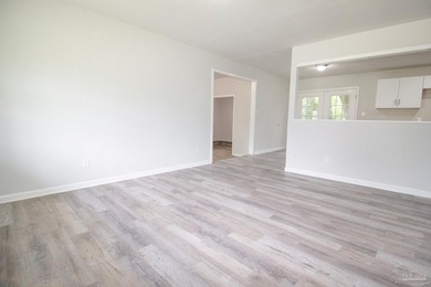 This adorable brick home offers 4 bedrooms and 2 full bathrooms - photo 3