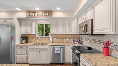 Designed with gathering in mind, this unique lake home was - photo 12